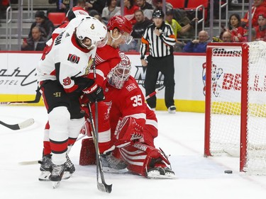 Detroit Red Wings goaltender Jimmy Howard (35) looks back before stopping a shot by Ottawa Senators right wing Bobby Ryan (9) during the first period of an NHL hockey game Wednesday, Jan. 3, 2018, in Detroit.