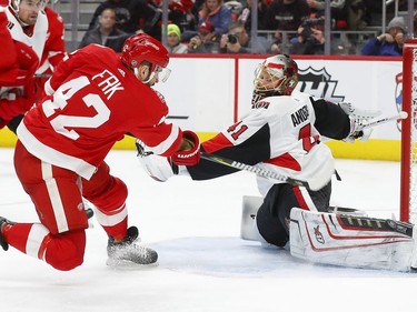 Ottawa Senators goaltender Craig Anderson (41) stops a shot by Detroit Red Wings right wing Martin Frk (42) during the second period of an NHL hockey game Wednesday, Jan. 3, 2018, in Detroit.