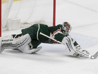 Minnesota Wild goalie Alex Stalock makes a diving save on a shot by Ottawa Senators' Mike Hoffman in the second period of an NHL hockey game Monday, Jan. 22, 2018, in St. Paul, Minn.