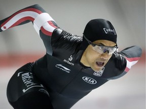 Gilmore Junio skates during the men's 500-metre race of the Olympic Speed Skating selections trials in Calgary on Friday. THE CANADIAN PRESS/Jeff McIntosh