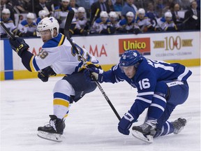 Blues defenceman Vince Dunn (29) tries to cut off Maple Leafs centre Mitchell Marner (16) in the first period of Tuesday's game at Air Canada Centre in Toronto. Stan Behal/Postmedia