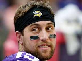 Minnesota Vikings wide receiver Adam Thielen sits on the bench during the second half of an NFL football game against the Chicago Bears on Dec. 31, 2017