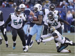 In this Dec. 31, 2017, file photo, Tennessee Titans running back Derrick Henry (22) gets past Jacksonville Jaguars defenders Eli Ankou (54), Telvin Smith (50) and A.J. Bouye (21) as Henry scores a touchdown on a 66-yard pass play in the first half of an NFL football game in Nashville, Tenn. The Jaguars (10-6) have allowed nine scoring plays of 25 or more yards _ and several more that led to points _ in the last six games. It's a negligible but noticeable nuance for a unit that is among the NFL leaders in nearly every defensive category.