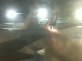 A WestJet plane's wing erupts in flames after a collsion with a second aircraft at Toronto's Pearson International Airport on Friday, Jan. 5, 2018.