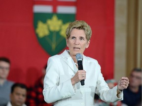 Premier Kathleen Wynne addresses questions from the public during a town hall meeting in Toronto on Monday, November 20, 2017.