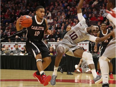 Ottawa's Brandon Robinson reacts after getting bumped by Carleton's Yasiin Joseph. Jana Chytilova/Postmedia