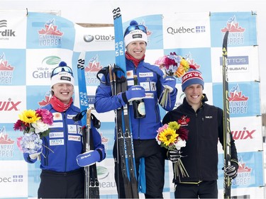First-place Petter Soleng-Skinstad, centre, second-place Andy Shields, right, and third-place Maarten Soleng Skinstad, left, celebrate at the medal ceremony for the men's 51K classic race on Saturday. Patrick Doyle/Postmedia
