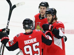 Senators' Mike Hoffman (right) celebrates his goal with teammates Matt Duchene and Ryan Dzingel during Tuesday's win over the Devils. (THE CANADIAN PRESS)