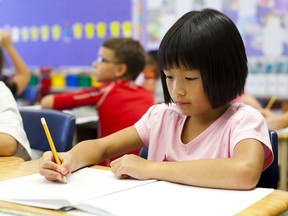 Angela Thai, a grade 3 student at Power Glen Public School, works on class assignments on Wednesday, September 14, 2011. The latest EQAO scores were released from both the local and public school boards.