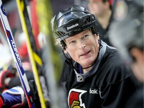 Jim Kyte chats on the bench during the Ottawa Senators alumni took to the ice for a warmup for their big game on Parliament Hill on Dec. 14, 2017. Julie Oliver/Postmedia
