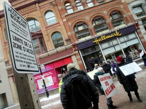 Temporary signs were in place on Thursday, Feb. 1, 2018, marking the 50-metre line protesters near the Morgentaler Clinic couldn't cross over on Sparks Street.