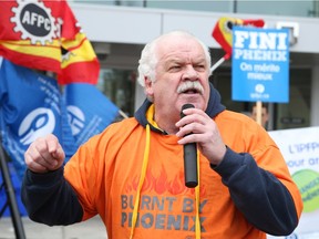 Chris Aylward, PSAC national executive vice-president, rallies the crowd at Wednesday's rally in front of the offices of Treasury Board president Scott Brison in Ottawa.   Jean Levac/Postmedia