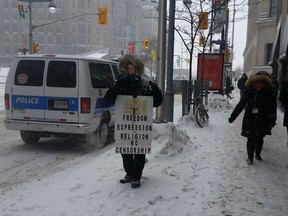 February 7, 2015 Protester on Bank St. just outside The Morgentaler Clinic.
