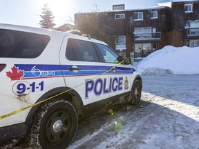 An Ottawa Police Service vehicle sits parked near 42 Northview Road where the major crime unit continues to investigate the shooting homicide of a 30 year old man.