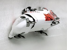 Pilot Justin Kripps, Jesse Lumsden, Cody Sorensen and Ben Coakwell of Canada 3 crash while competing during the men's four-man bobsleigh heats of the Sochi 2014 Winter Olympics on Feb. 22, 2014.