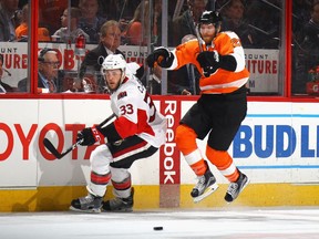 Claude Giroux of the Flyers attempts to get past Fredrik Claesson of the Senators during a game in Philadelphia last March. Giroux has enjoyed good production against Ottawa during his NHL career.