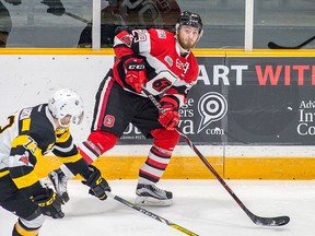 Ottawa 67's forward Tye Felhaber skates past Kingston Frontenacs forward Gabe Vilardi  during OHL play Wednesday in Ottawa. (Valerie Wutti photo)