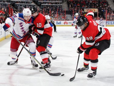 The Senators' Tom Pyatt (10) and Johnny Oduya defend against Jimmy Vesey of the Rangers in the third period at Canadian Tire Centre.