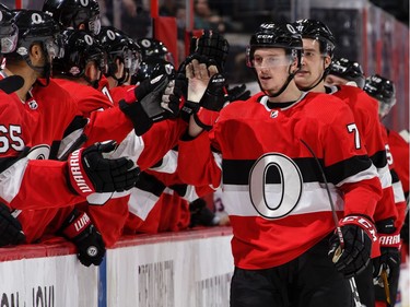 Thomas Chabot of the Senators celebrates his third-period goal against the Rangers with teammates at the bench.