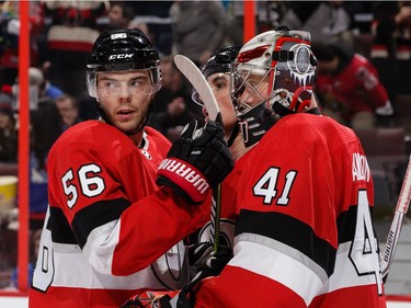 Magnus Paajarvi, Cody Ceci and Craig Anderson of the Senators celebrate their team's 6-3 win against the Rangers at Canadian Tire Centre on Saturday.