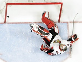 The puck lies in the Senators net after getting past Craig Anderson for a goal by the Predators' Craig Smith in the third period of Monday's game. The Predators won 5-2.