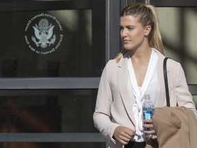 Tennis star Eugenie Bouchard leaves Brooklyn Federal court, Wednesday, Feb. 21, 2018, in New York. Bouchard testified during her negligence lawsuit against the United States Tennis Association that a wet floor caused her to slip and fall inside a locker room at the 2015 U.S. Open.