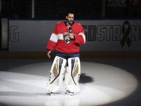 Florida Panthers goaltender Roberto Luongo (1) talks to fans about the shooting at Marjory Stoneman Douglas High School, prior to an NHL hockey game against the Washington Capitals, Thursday.