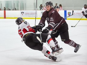 Carleton’s Alexandre Boivin goes down after colliding with uOttawa’s Michael Poirier at the Ice House last night. (Marc Lafleur / Carleton Ravens)