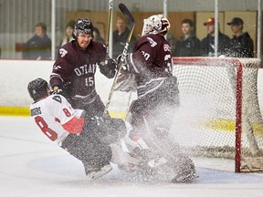 Carleton's Dakota Odgers slides into Ottawa netminder Anthony Brodeur, with the Gee-Gees' Marc Beckstead also nearby during Sunday's first-round playoff series finale. Marc Lafleur/Carleton photo