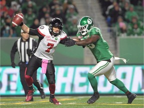 A.C. Leonard, then with the Roughriders, pressures Redblacks quarterback Trevor Harris during a game in Regina last Oct. 13.