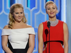 In this handout photo provided by NBCUniversal, Presenters Amy Schumer and Jennifer Lawrence speak onstage during the 73rd Annual Golden Globe Awards at The Beverly Hilton Hotel on January 10, 2016 in Beverly Hills, California. (Photo by Paul Drinkwater/NBCUniversal via Getty Images)