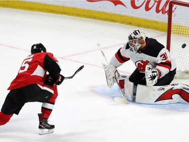 Ottawa Senators Zack Smith(15 ) scores on New Jersey Devil goaltender Keith Kinkaid(1) during second period NHL action in Ottawa, Tuesday, February 6, 2018.