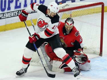 New Jersey Devils Brian Boyle (11)attempts to screen Ottawa Senators goaltender Craig Anderson (41) during second period NHL action in Ottawa, Tuesday, February 6, 2018.THE CANADIAN PRESS/Fred Chartrand ORG XMIT: FXC110