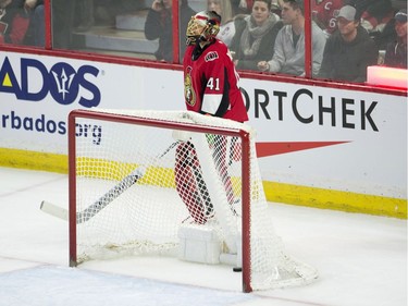 Ottawa Senators goaltender Craig Anderson stands behind the net as the goal light turns on for a goal during third period NHL action against the Philadelphia Flyers, Saturday, February 24, 2018 in Ottawa. The Flyers scored after the puck bounced off the glass and into the net, catching Anderson out of position behind the net.THE CANADIAN PRESS/Adrian Wyld ORG XMIT: ajw107