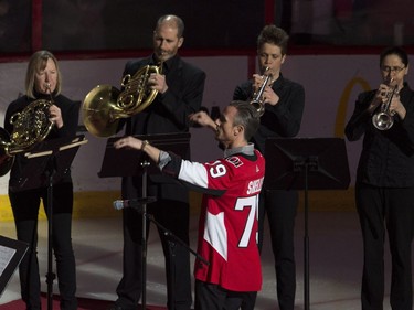 Members of the National Arts Centre orchestra perform the national anthems before the Lightning-Senators game on Thursday night.