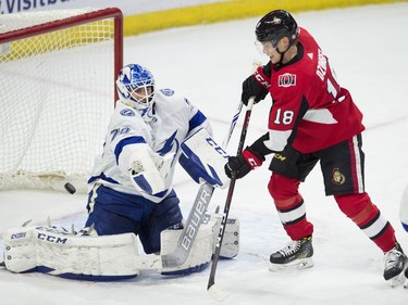 Senators left-winger Ryan Dzingel tries to tip a shot past Lightning goaltender Louis Domingue during the third period of Thursday's game at Canadian Tire Centre.