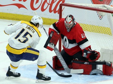 Nashville Predators Craig Smith attempts to shoot the puck past Ottawa Senators goaltender Craig Anderson (41) during first period NHL action in Ottawa, Thursday, February 8, 2018 .