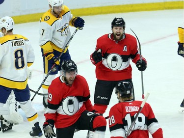 Ottawa Senators Christopher DiDomenico (49) celebrates his goal against the Nashville Predators with teammates Ryan Dzingel (18) and Zack Smith (15) during first period NHL action in Ottawa, Thursday, February 8, 2018.