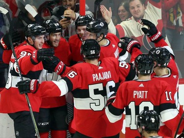 The Ottawa Senators' Mike Hoffman, second from the left, celebrates his winning overtime goal against the Nashville Predators with teammates during NHL hockey action in Ottawa on Thursday, Feb. 8, 2018.