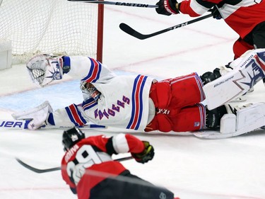 Ottawa Senators defenceman Johnny Oduya scores on New York Rangers goaltender Henrik Lundqvist in the first period.