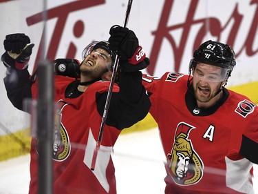 Ottawa Senators' Derick Brassard, left, celebrates with Mark Stone after scoring late in the third period to tie the game.