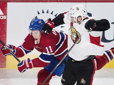 Montreal Canadiens right wing Brendan Gallagher (11) collides with Ottawa Senators left wing Christopher DiDomenico (49) during second period NHL hockey action in Montreal, Sunday, February 4, 2018.