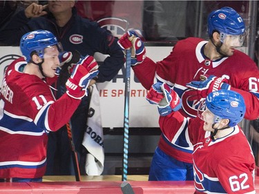 Montreal Canadiens left wing Artturi Lehkonen (62) celebrates with teammates right wing Brendan Gallagher (11) and left wing Max Pacioretty (67) after scoring against the Ottawa Senators during second period NHL hockey action in Montreal, Sunday, February 4, 2018.