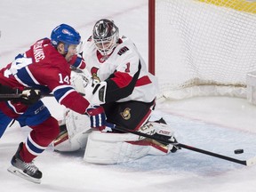 Montreal Canadiens centre Tomas Plekanec (14) moves in on Ottawa Senators goaltender Mike Condon (1) during second period NHL hockey action in Montreal, Sunday, February 4, 2018.