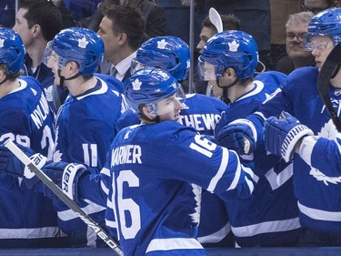 The Maple Leafs' Mitchell Marner celebrates with teammates after scoring in the first period. THE CANADIAN PRESS/Chris Young