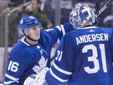 Maple Leafs forward Mitchell Marner, the star of Saturday's game, congratulates netminder Frederik Andersen following the 6-3 victory against the Senators. THE CANADIAN PRESS/Chris Young