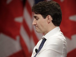 Prime Minister Justin Trudeau listens to a question from David Axelrod at the University of Chicago Institute of Politics in Chicago on Wednesday, Feb. 7, 2018.