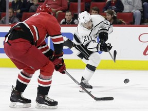 Nick Shore shoots the puck at the Hurricanes' net during the Kings' game at Raleigh on Tuesday night. Shore completed the game with L.A. and then became property of the Senators following the trade with Marian Gaborik for Dion Phaneuf and Nate Thompson.