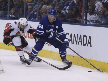 Senators centre Derick Brassard chases Maple Leafs defenceman Morgan Rielly along the boards during the second period. Jack Boland/Postmedia