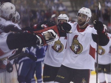 Senators centre Derick Brassard is congratulated by teammates after scoring in the third period. Jack Boland/Postmedia